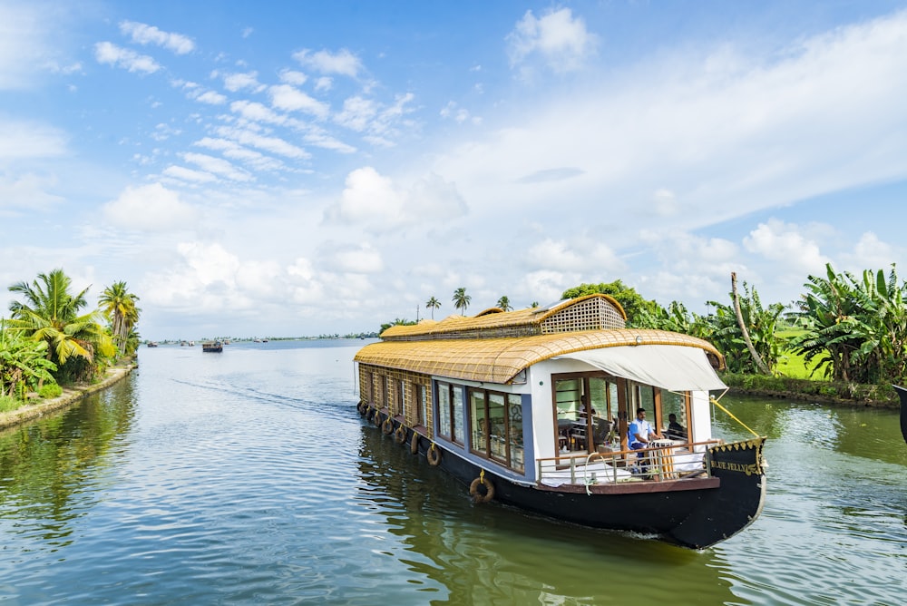 A fisherman rowing his canoe on the Alleppey backwaters at dawn