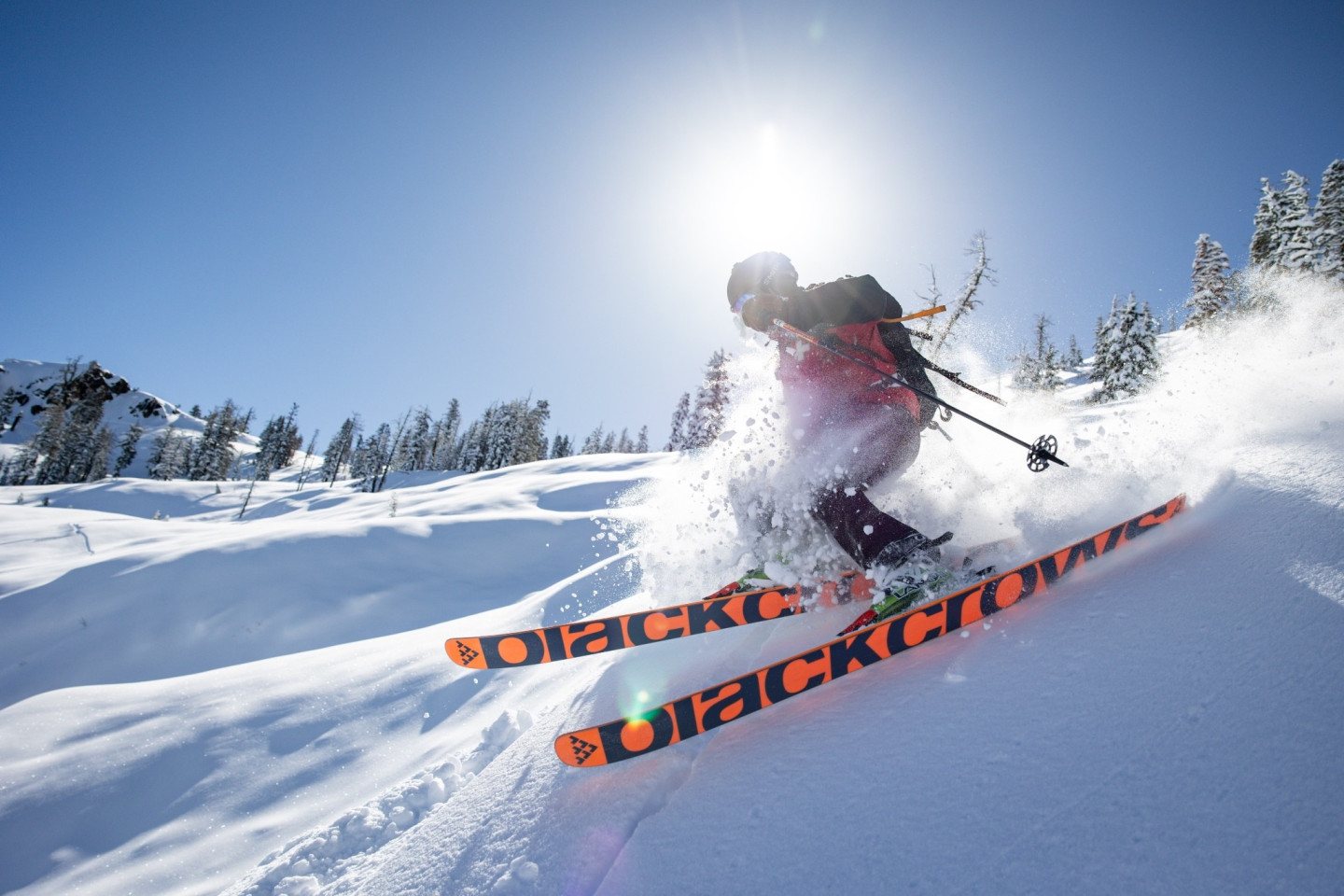 A skier carving through deep untracked powder