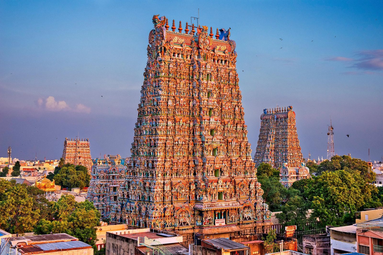 The painted gopuram towers of the Meenakshi temple at dusk